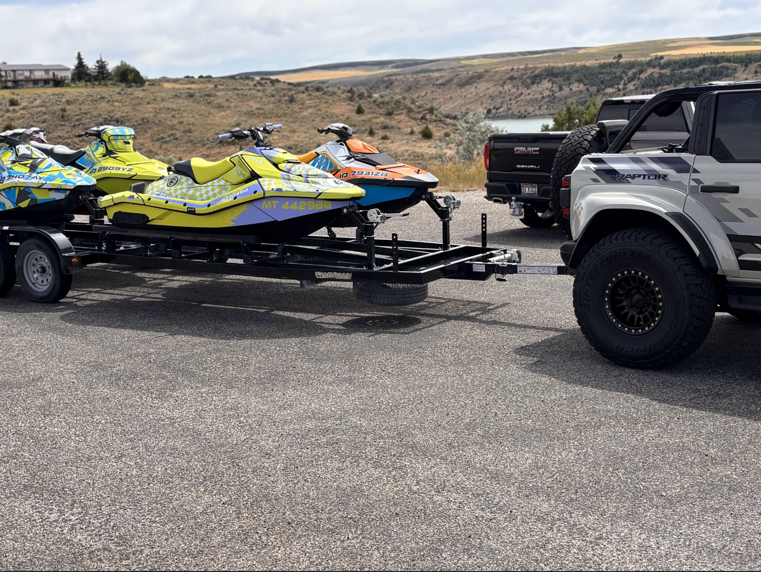 Sea-Doo jet skis on trailer featuring custom Deviant Ink wraps: Illusionist, Tek, and Abstract 1